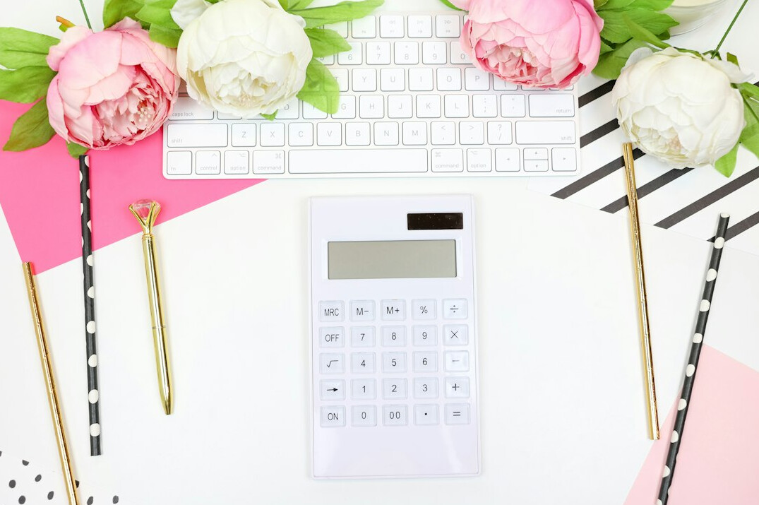 calculator on desk with papers