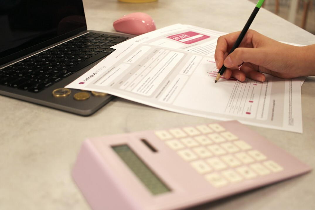 person using calculator for loan